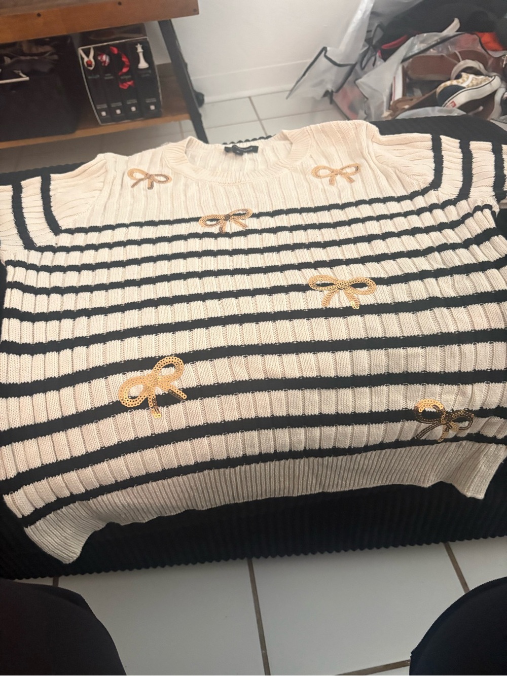Cream & Black Striped Crewneck Sweater with Gold Bow Accents